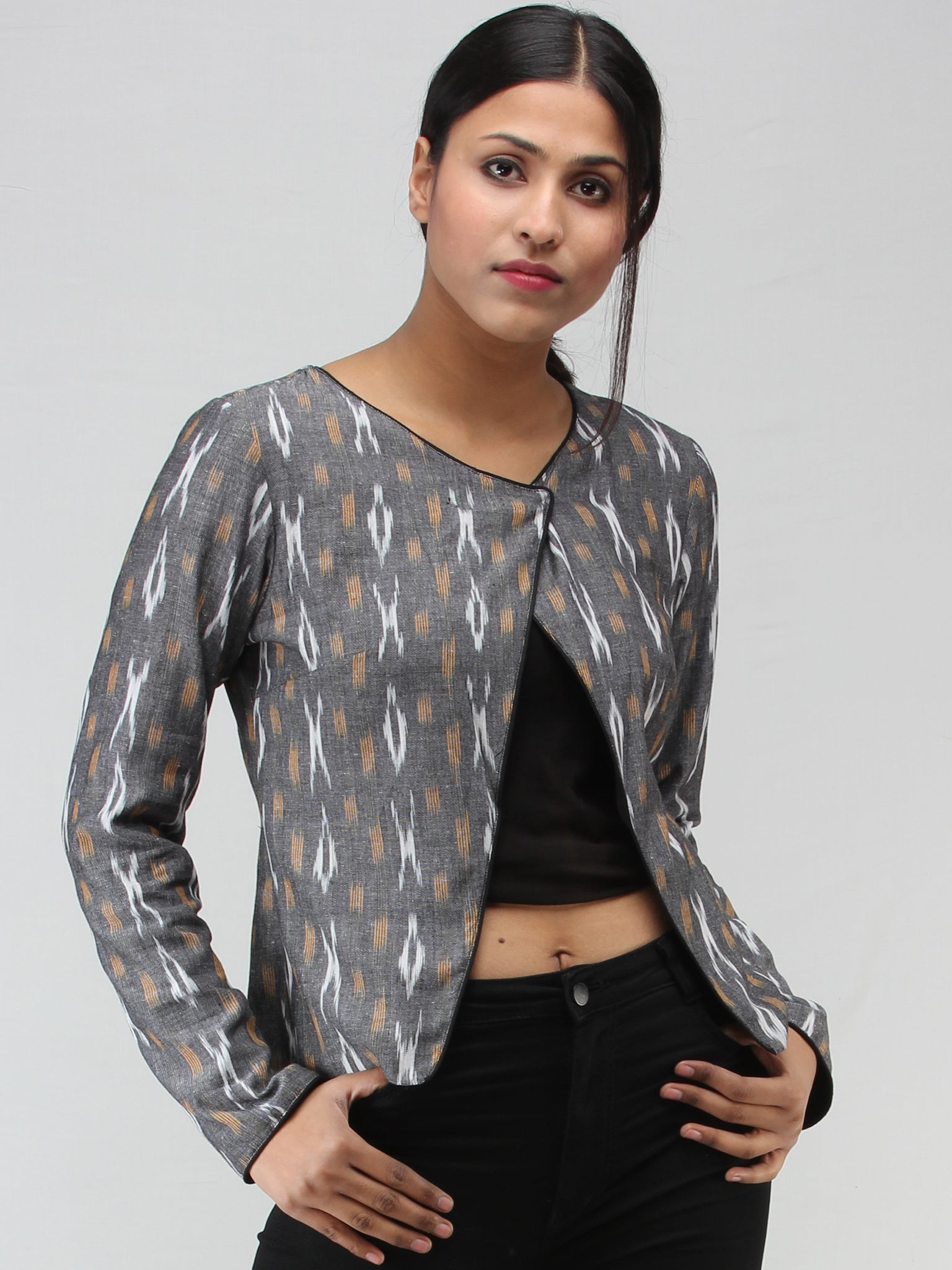 White ikat crop top with ash grey jacket by Desi Doree