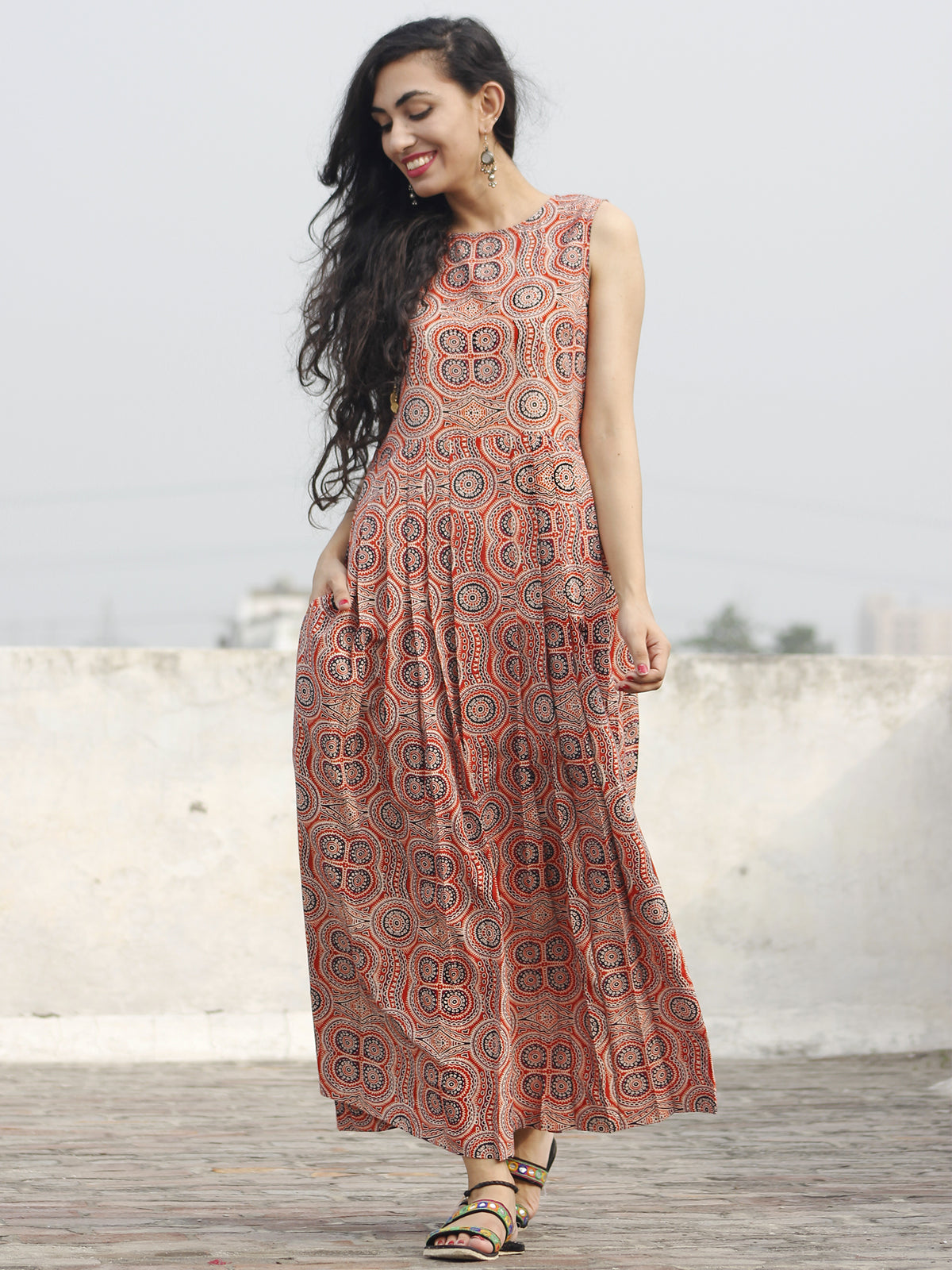 Red Maroon Black Ivory Long Sleeveless Ajrakh Hand Block Printed Cotton Dress With Knife Pleats & Side Pockets - D32F682